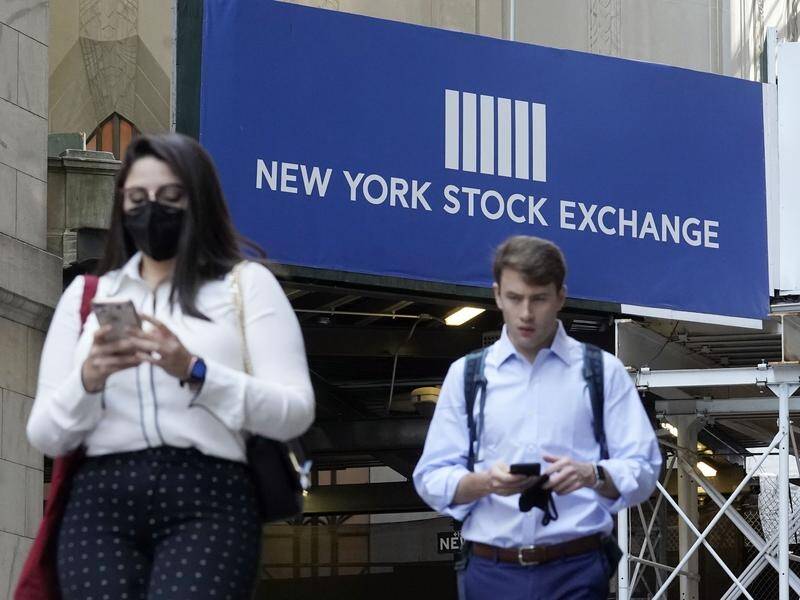 Stocks closed lower after investors learned of sooner than expected rate hikes.