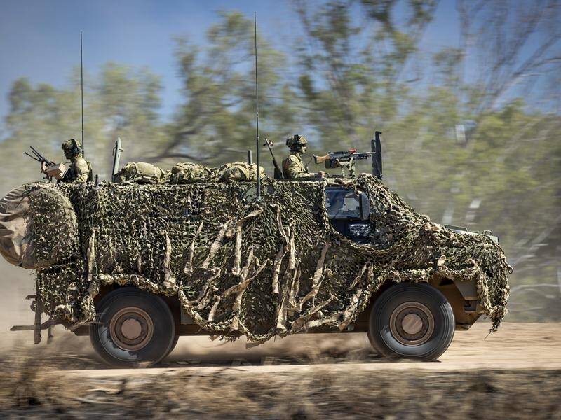 Soldiers have been injured in the rollover of a Bushmaster vehicle in the NT. (AP PHOTO)