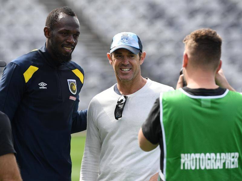 NSW Origin coach Brad Fittler (c) was among the admirers when Usain Bolt trained with the Mariners.
