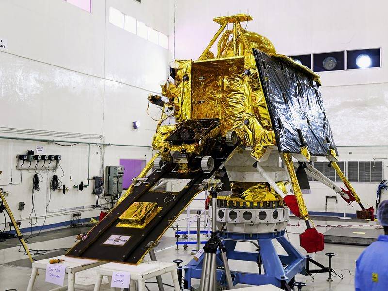 Scientists work on the orbiter vehicle of 'Chandrayaan-2', part of India's planned moon mission.