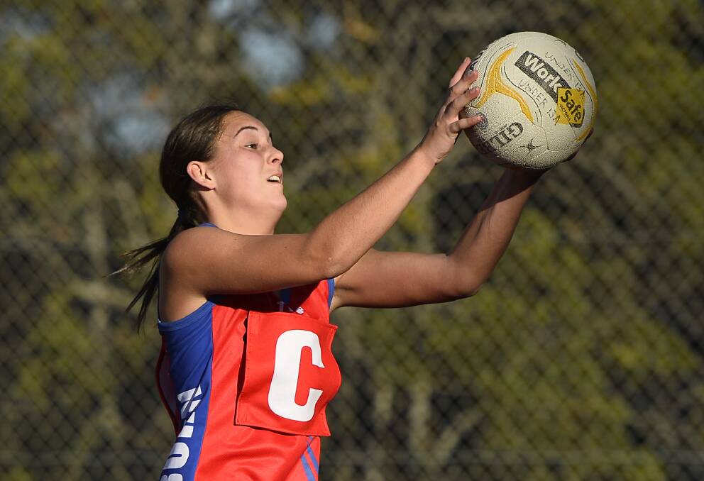 YOUNG-GUN: Kira Howard of the Burras catches the ball during Central Highlands Netball League round eight.