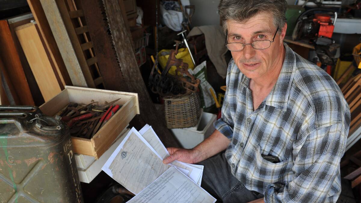 Clunes resident Michael Rogers has found war documents stored in a cardboard tube in a box of tools he purchased at an auction in Ballarat. 
