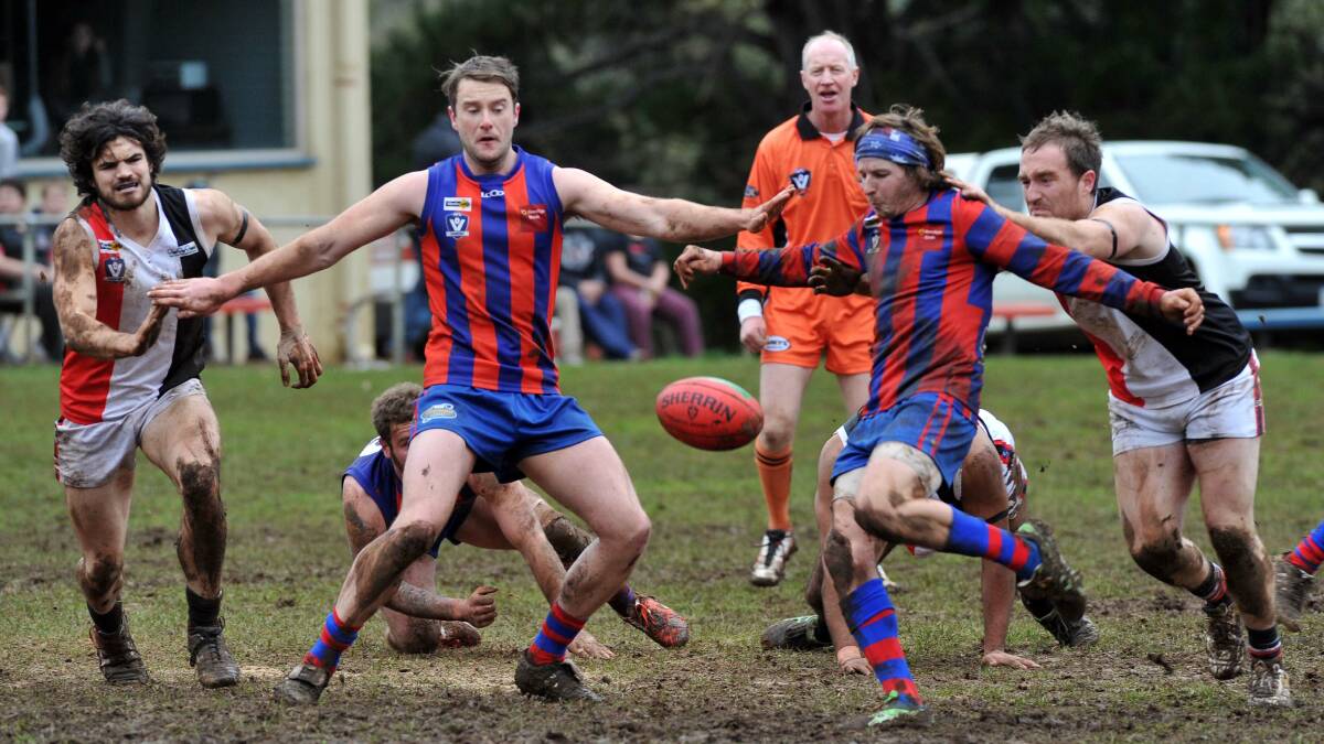 CENTRE BREAK: Hepburn’s Andy McKay gets a kick away during the weekend’s clash with Creswick. Pictures: JULIE HOUGH