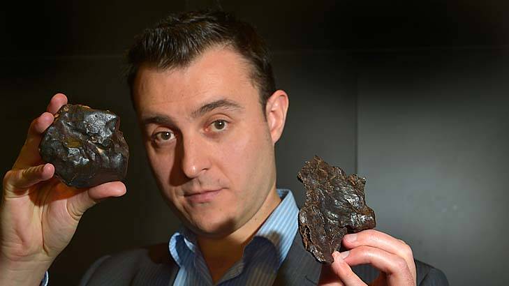 Down to earth … Jeff Kuyken holds a stone meteorite.
