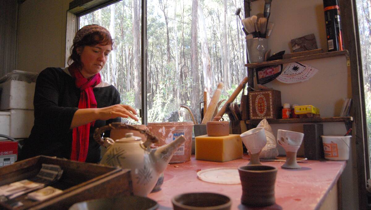 Minna Graham throws some clay for guests