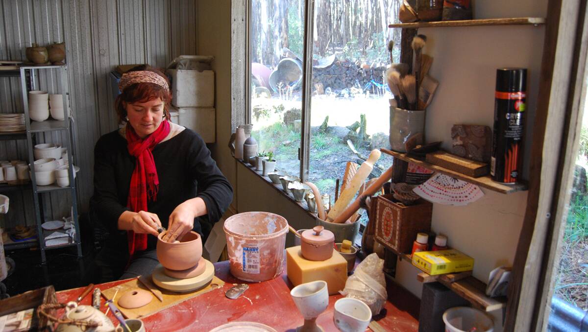 Minna Graham throws some clay for guests